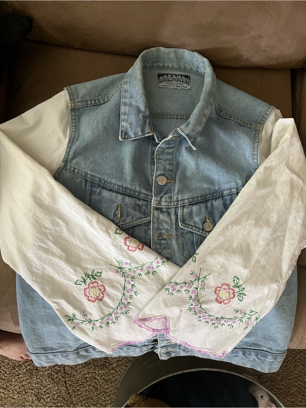 Denim vest with embroidered sleeves